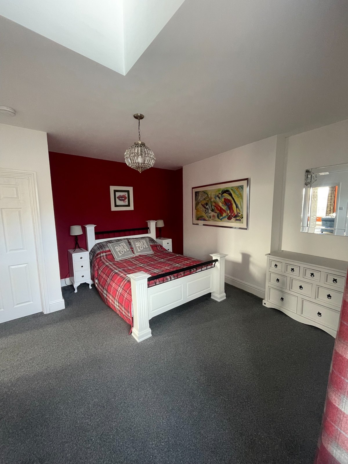 Bedroom with red feature wall