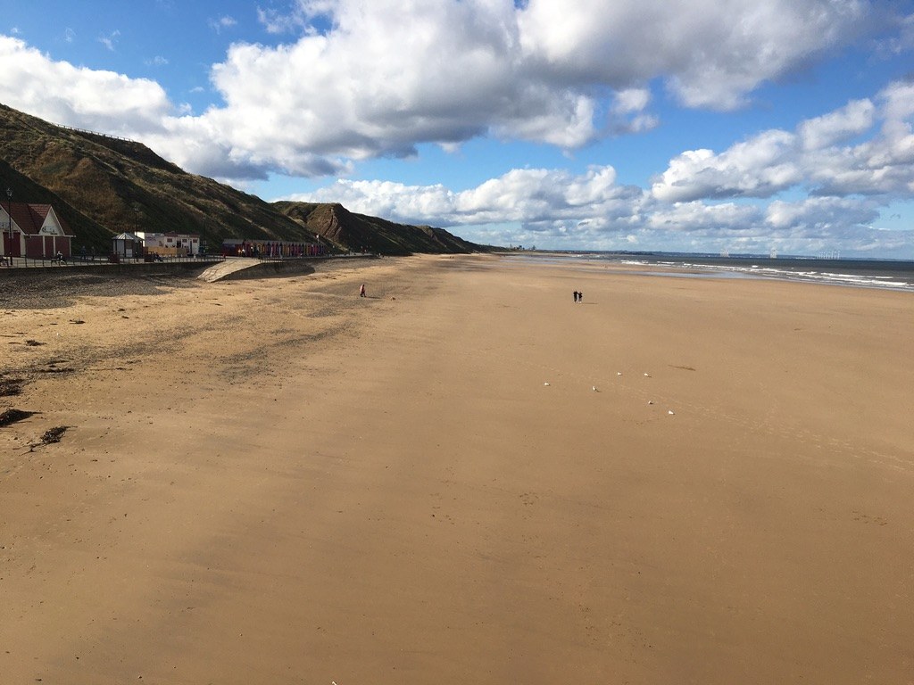 Saltburn beach beneath a blue sky